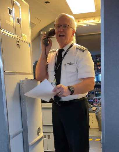 An airplane pilot delivers a retirement speech to his passengers before takeoff.
