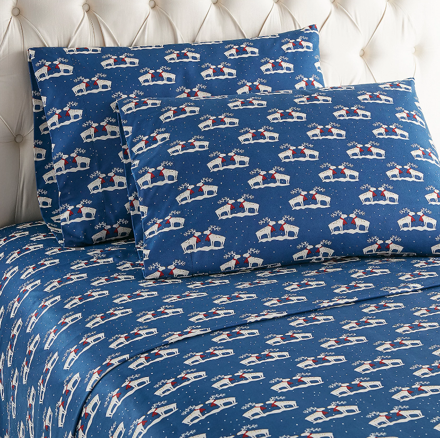 Shavel Queen Micro Flannel Printed Deep-Pocket Sheet Set from QVC in Navy Blue with a reindeer pattern.