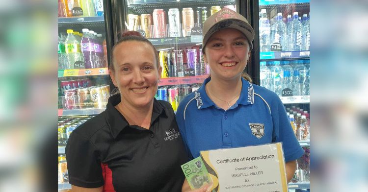 A teen girl receives a certificate of appreciation for stopping a runaway bus.