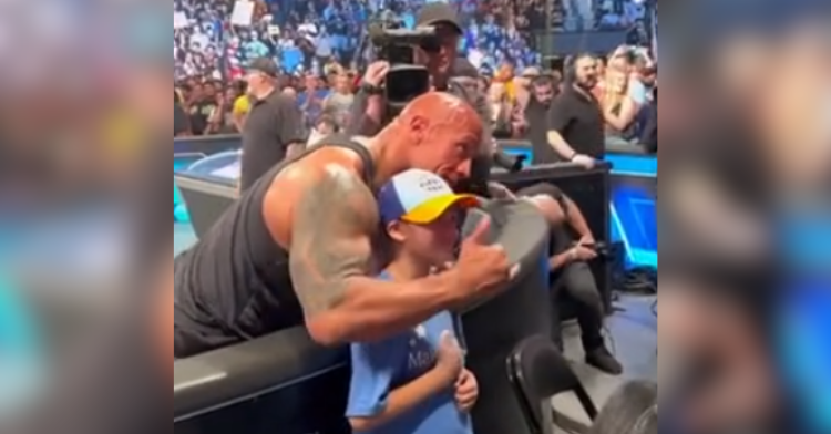 the rock and kid take photo