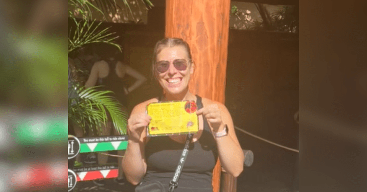 woman holds pass