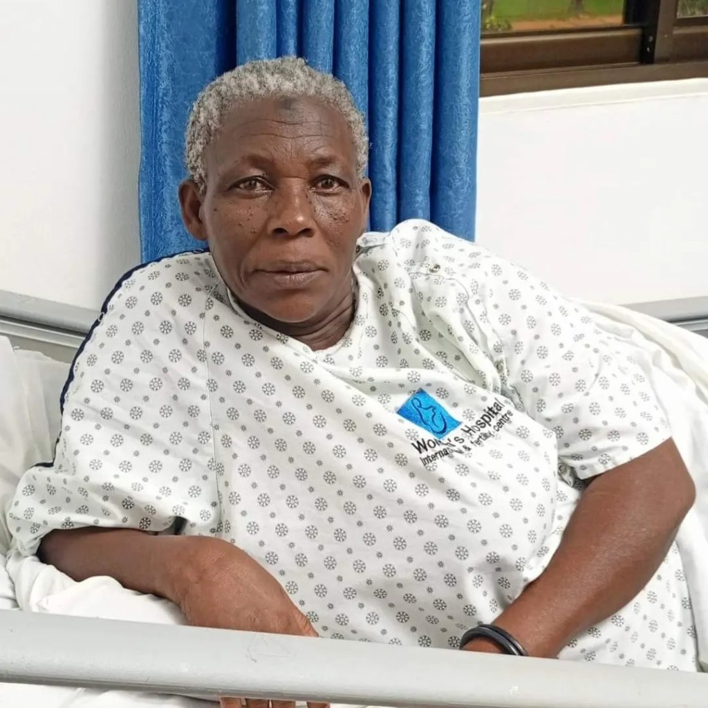 Safina, the 70-year-old woman who gave birth to twins, smiles as she props herself up in a hospital bed.