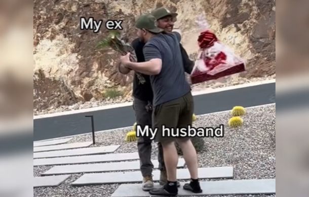 Both men hugging.