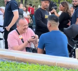 man proposes to man at Disneyland