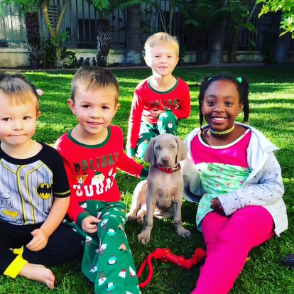 girl and boys with puppy