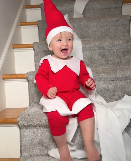 baby dressed up as elf on the shelf
