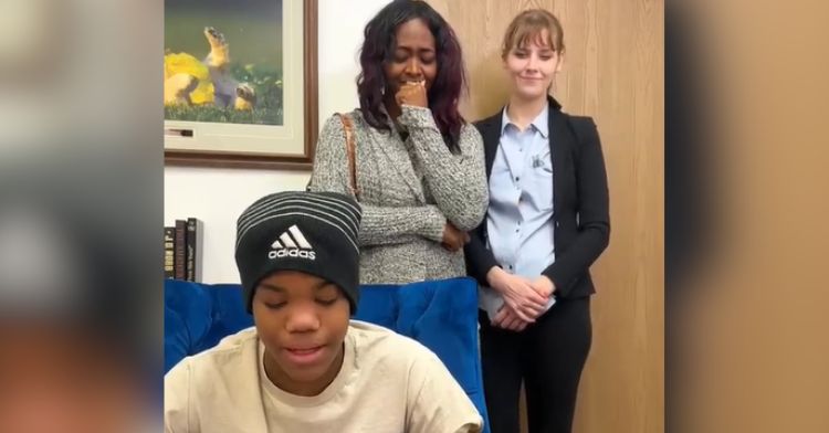 A boy reading a letter asking his aunt to adopt him.