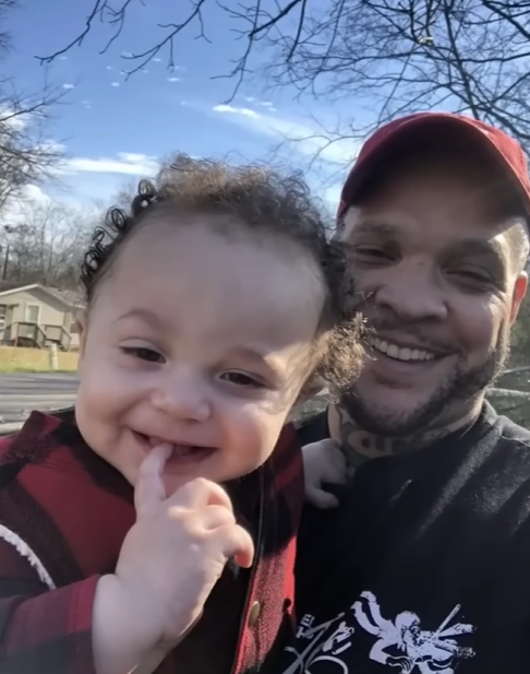 Aramis Youngblood smiles as he takes a selfie with his son, Lord, the baby who was recently sucked up by a tornado in Tennessee.