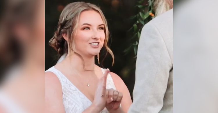 A bride uses sign language to communicate her wedding vows.