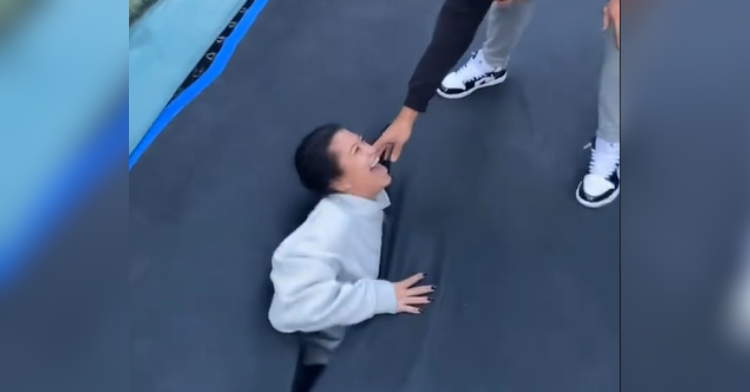 girl stuck in broken trampoline