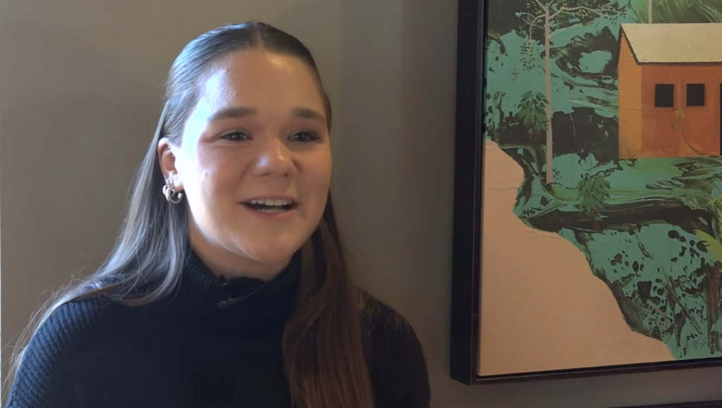 A close up of a young woman, Jordyn Vermont, smiling as she talks.