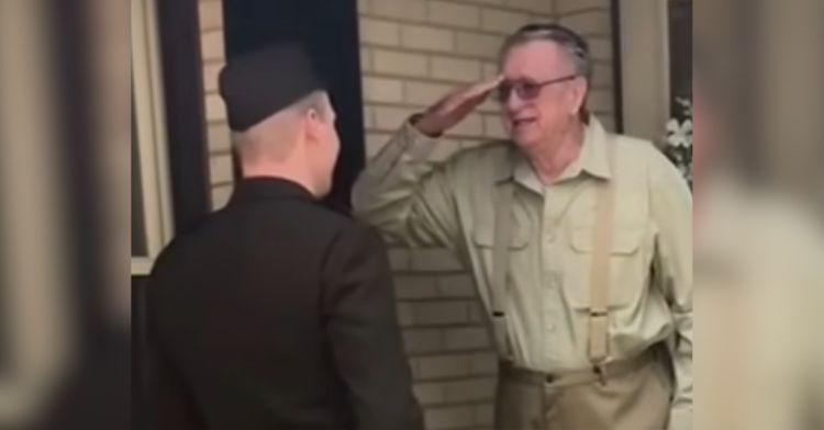 A grandfather salutes his grandson in the army.