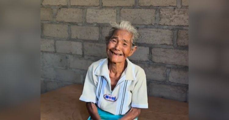 An elderly woman tears up with gratitude after Rescue 2000 builds her a new home.