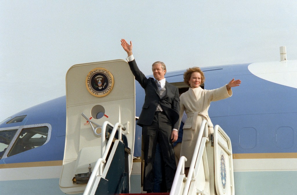 President Jimmy Carter and his wife, Rosalynn Carter, descending from an airplane. 