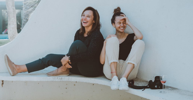 Two girls laughing