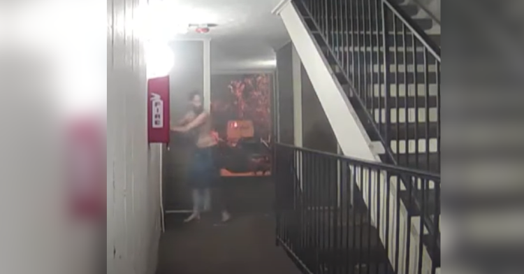 man knocks on door in apartment buildling