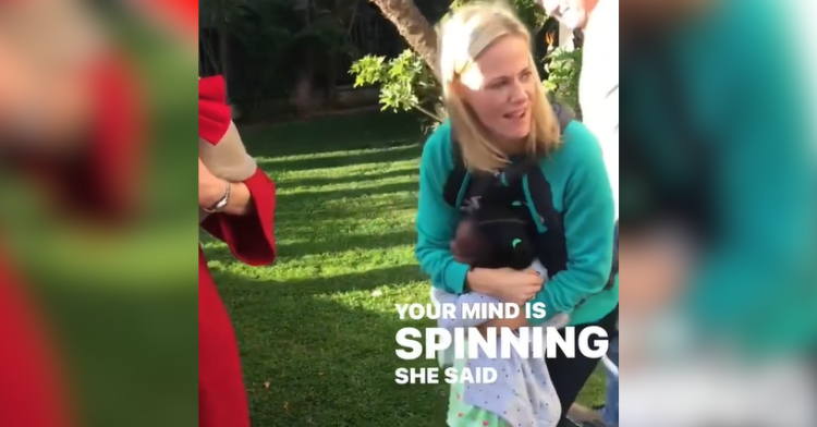 mom holds girl who is passing out