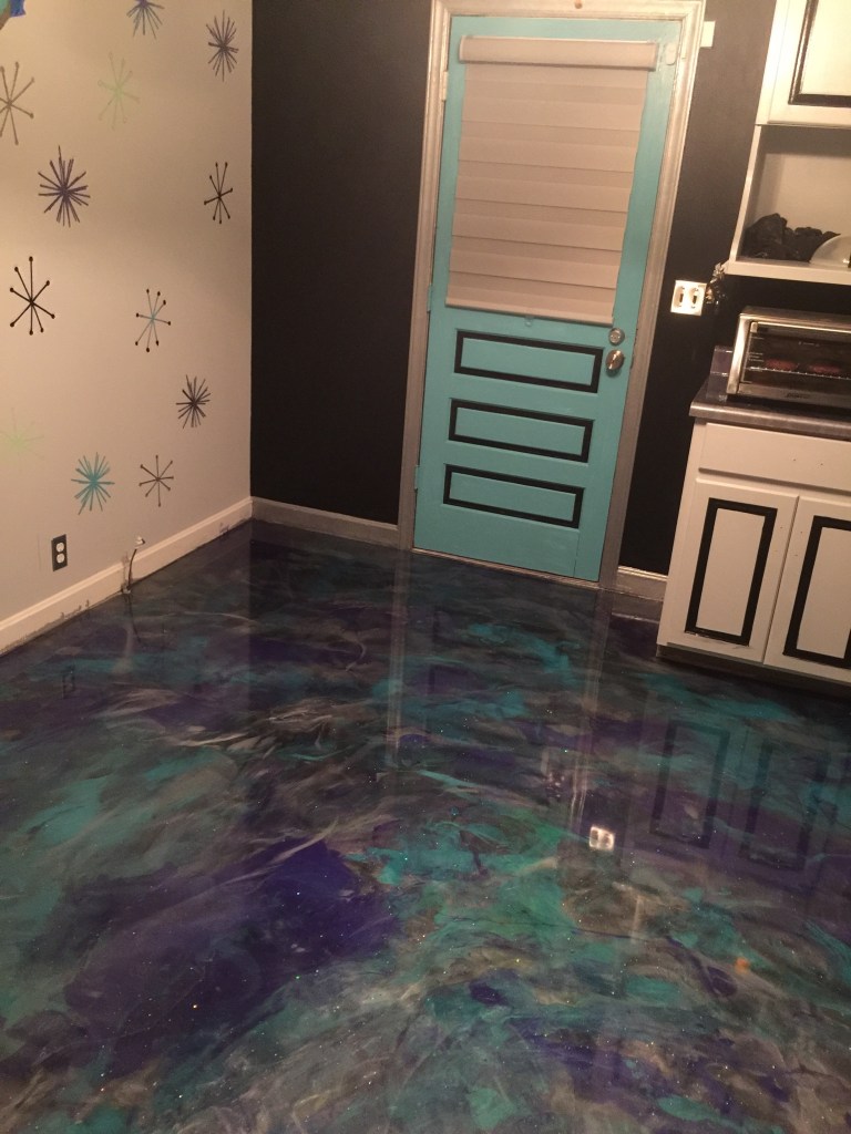 A multi-colored, glow-in-the-dark resin floor during the day.