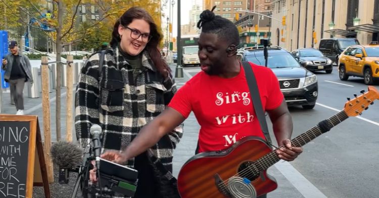 An office worker sings on the street with a famous YouTuber.