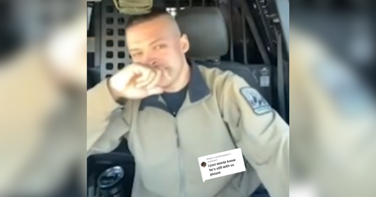 Officer Kyle Kaelberer covers his mouth with his hand, holding back tears.