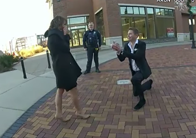 A man proposes to his girlfriend during a traffic stop. 