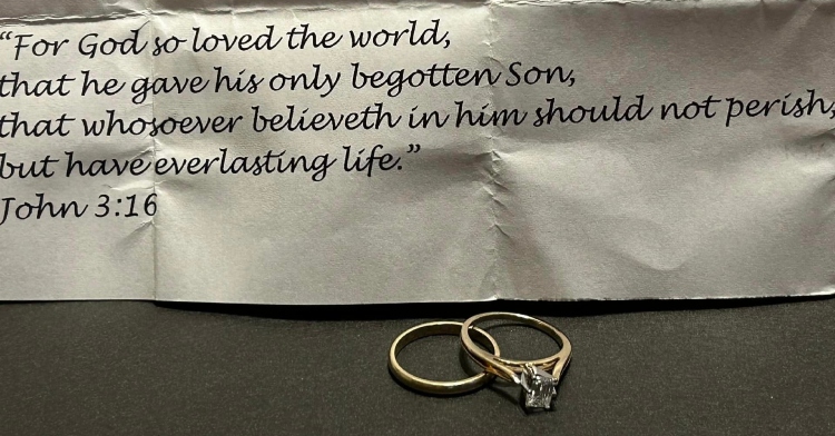 Note from a widow that's partially cut off. What we can read is this: "For God so loved the world, that he gave his only begotten Son, that whoever believeth in him should not perish, but have everlasting life." John 3:16 Below the note is a wedding band and engagement ring with a square diamond.