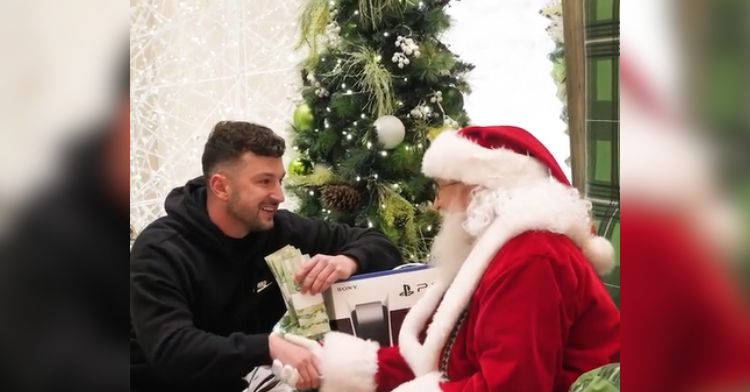 Zachery Dereniowski teams up with Santa to give away cash.