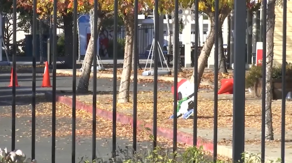 View through a fence of an outside area at St. Hilary School in California.