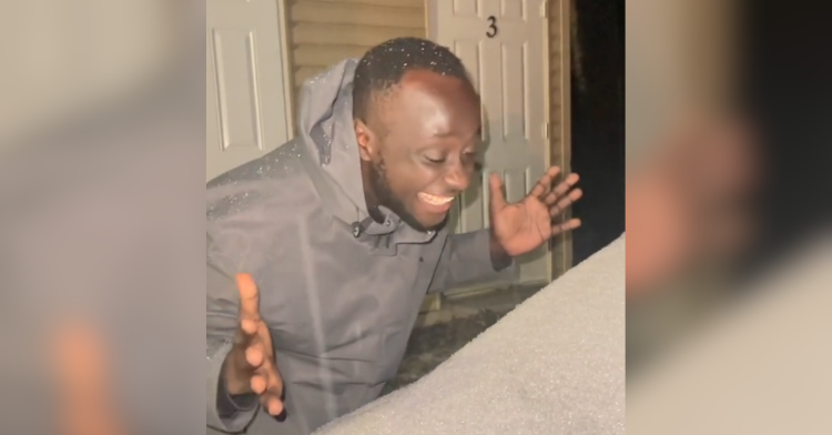 Ugandan man seeing snow for the first time.
