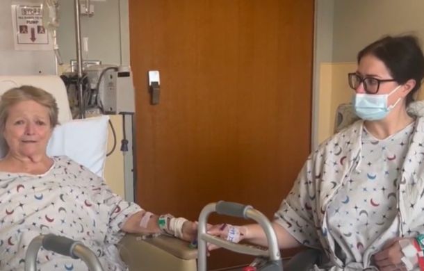 Julia and Eileen Harlin in the hospital consoling one another.