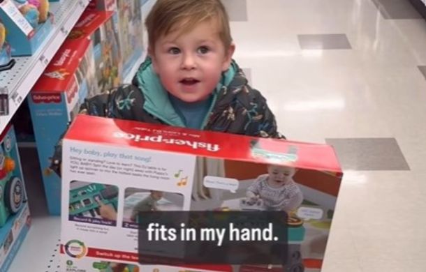 Kid in a toy store telling his dad "It fits in my hand."