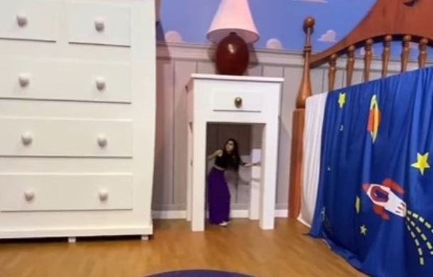 Walking under the nightstand gives you a feel of how large this replica of Andy's room really is.