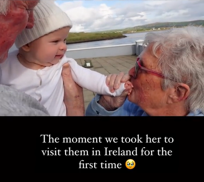 A couple of grandparents in Ireland hold their grandkid's new baby.
