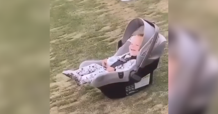 baby laughing on golf course