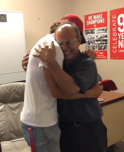 Baseball player Robert Anthony Cruz hugs his dad.