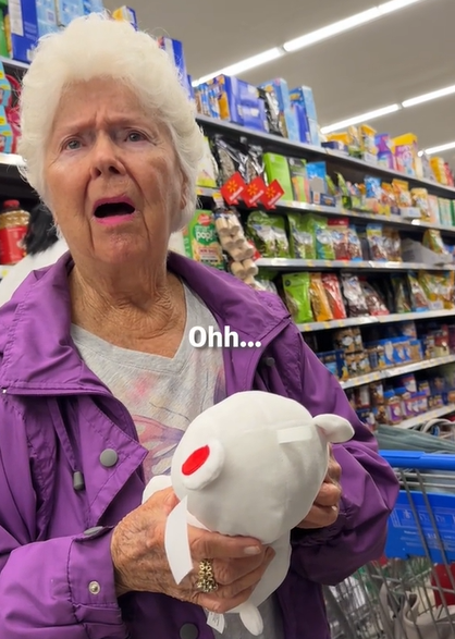 An elderly woman gets emotional when a stranger gives her a gift. 