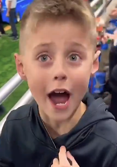 A young fan is excited that Daniel Carson signed his Raiders jersey.