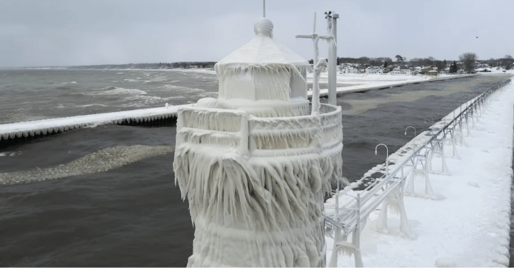 View of one of the Lake Michigan lighthouses that are frozen over.