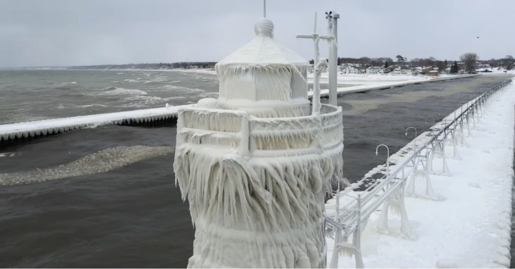 View of one of the Lake Michigan lighthouses that are frozen over.