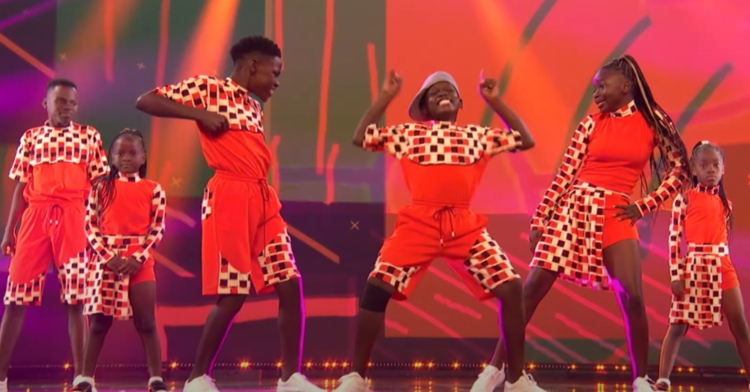 Six members of the Triplets Ghetto Kids dance in colorful outfits on "AGT."