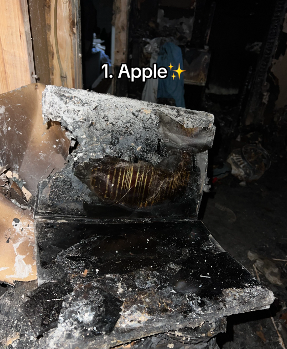 Close up of a totally burned laptop. Text on the image reads: 1. Apple