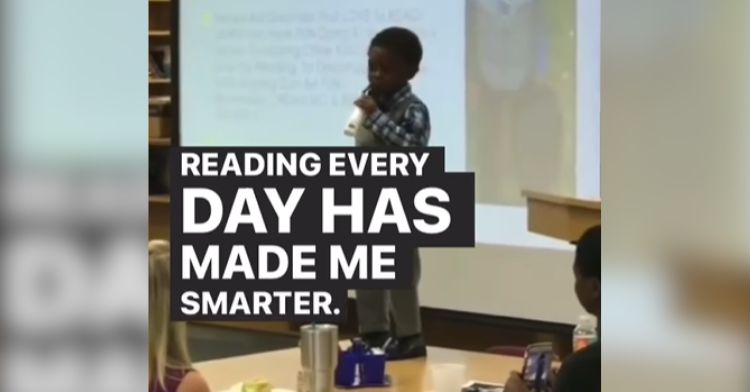 A little boy gives a speech about the importance of reading.