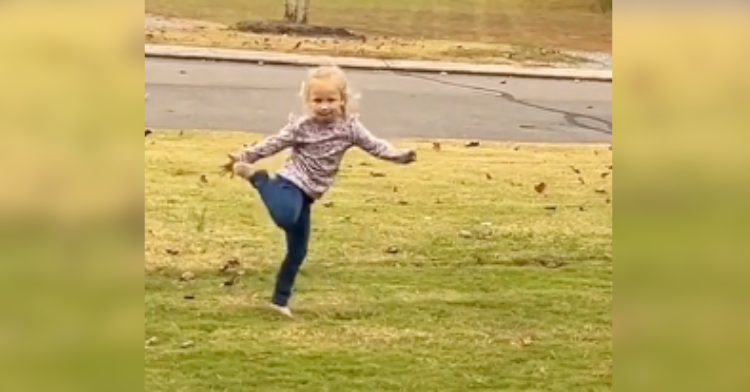 kid dancing in lawn