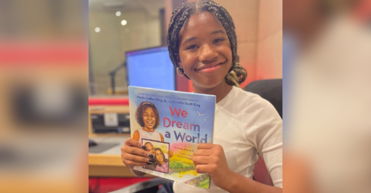 little girl with children's book