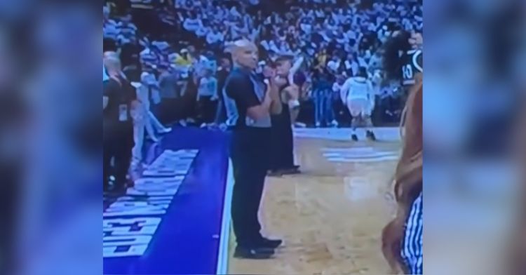 A ref for the NBA gets ready to send a secret signal to his wife on television.