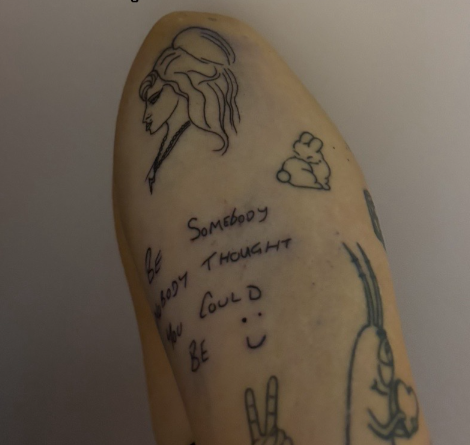 View of tattoos on someone's leg. One of them is the following message: Be somebody nobody thought you could be :)