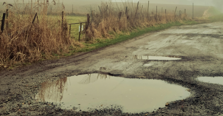 pothole on a dirt road