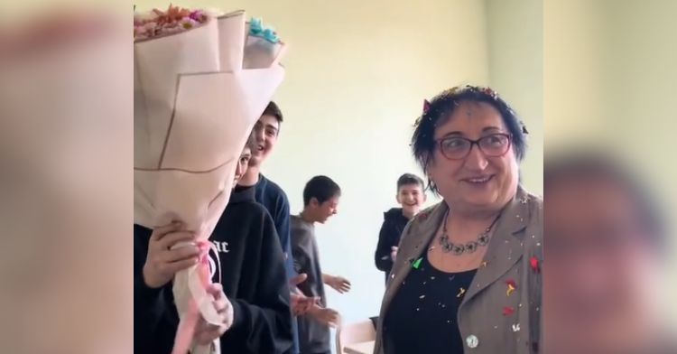A teacher is surprised by her students' birthday prank.