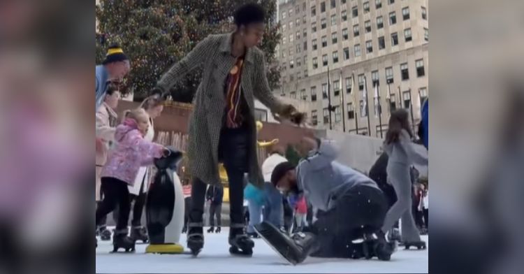 A man falls on the ice while trying to pull off a holiday proposal.