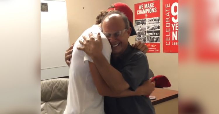 Baseball player Robert Anthony Cruz hugs his dad.